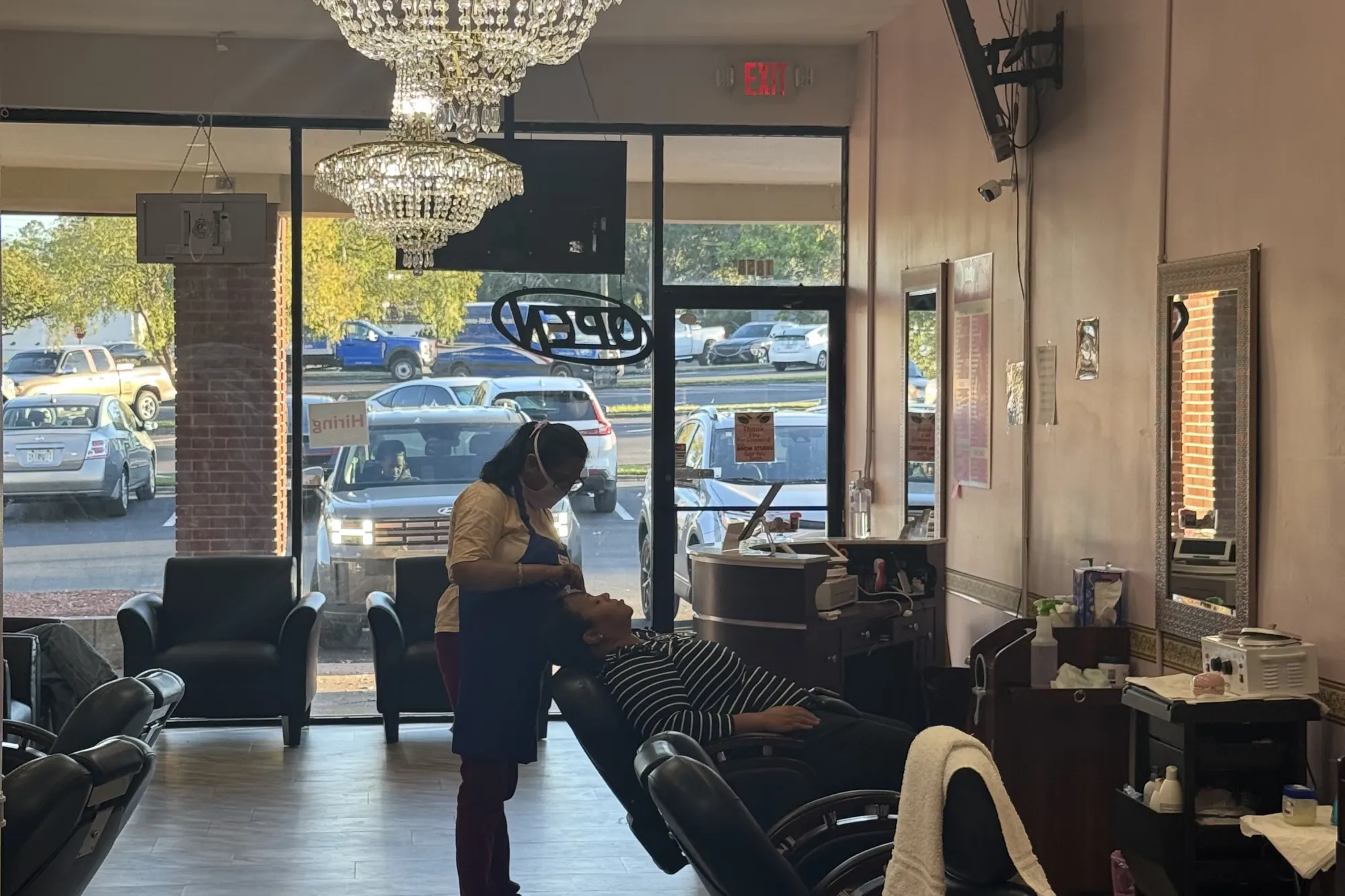 Chandelier and lobby seating inside Tally Brow Studio on Thomasville Road in Midtown Tallahassee